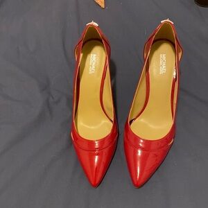 Michael Kors red patent pumps. Great condition. Never worn.
